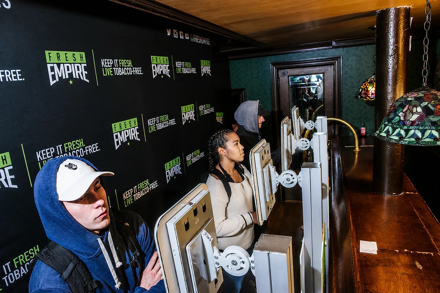 The Fresh Empire booth kiosk and branded prize wheel at an event