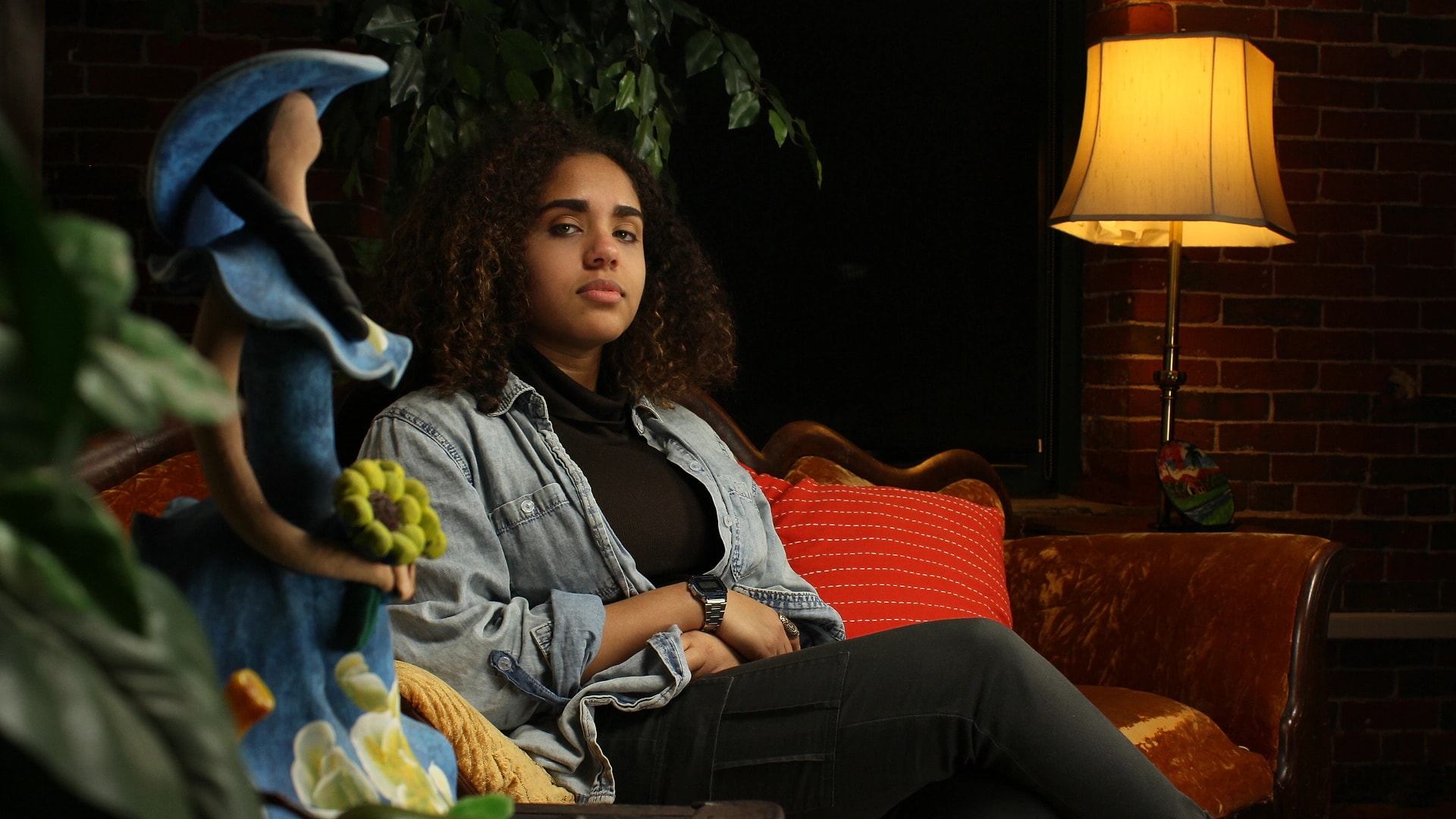 A creator relaxing on the studio couch between sessions at Gifted Studios