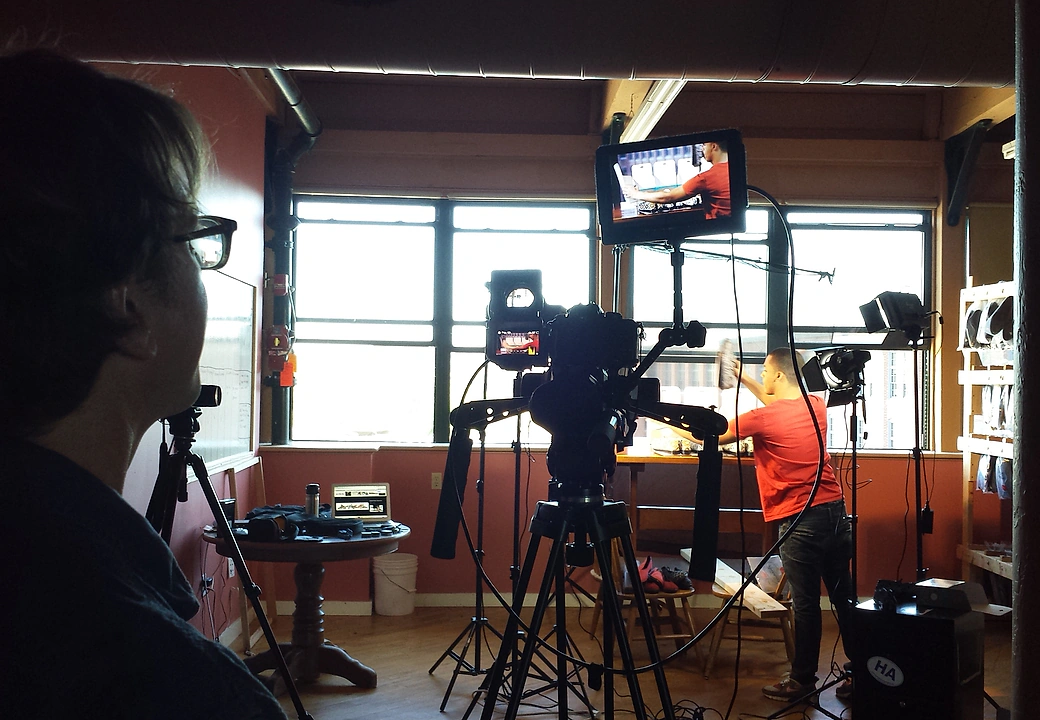Behind the scenes of a Gifted Studios photoshoot with cameras and lights