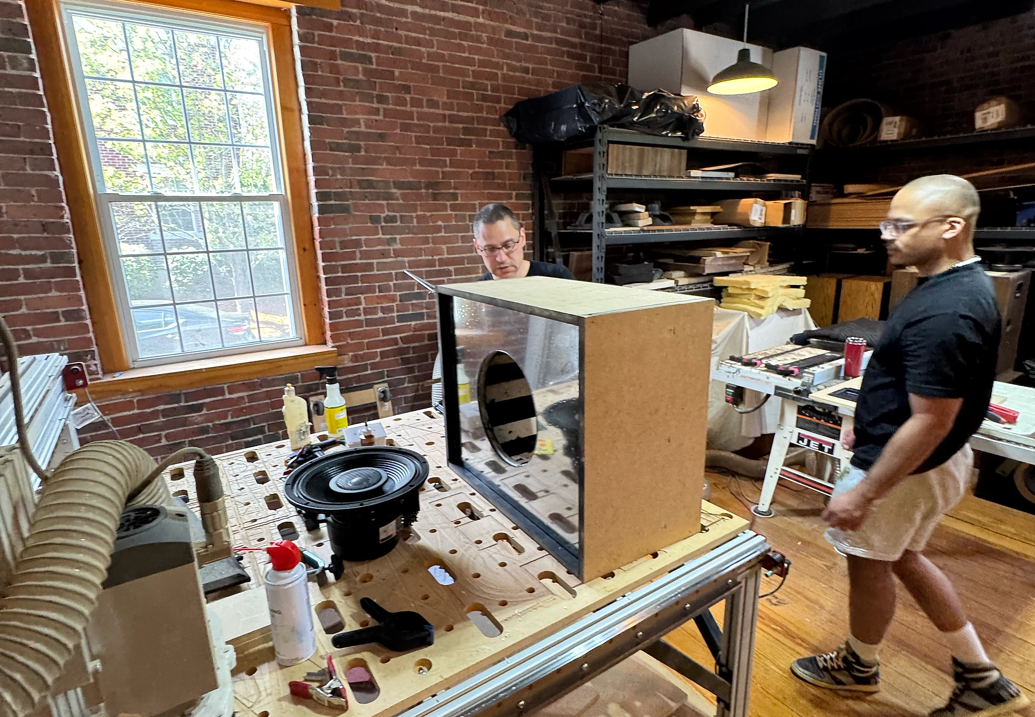 Mirror-panel cabinet and driver on the workbench during fabrication